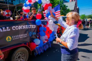 Candace "Candy" Owens helping organize the Quality Connections Fourth of July float.