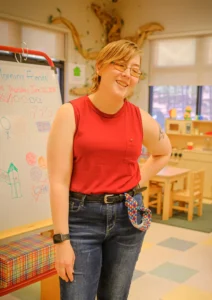 Susan Decker standing in her preschool classroom