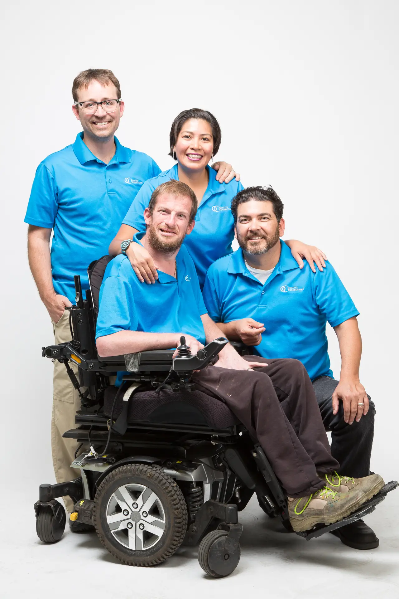 Doug Arnett, Tonnya Jensen, and Armando Bernasconi, surrounding John Thoren.