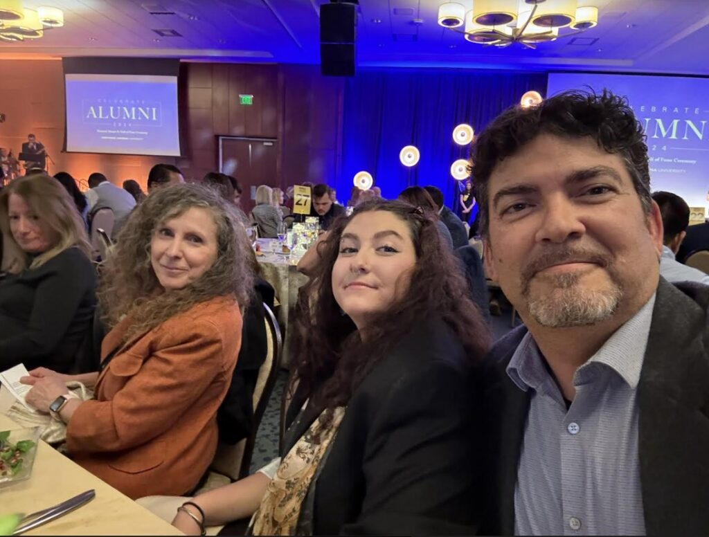 Melissa and Armando Bernasconi with their daughter at NAU Hall of Fame ceremony.