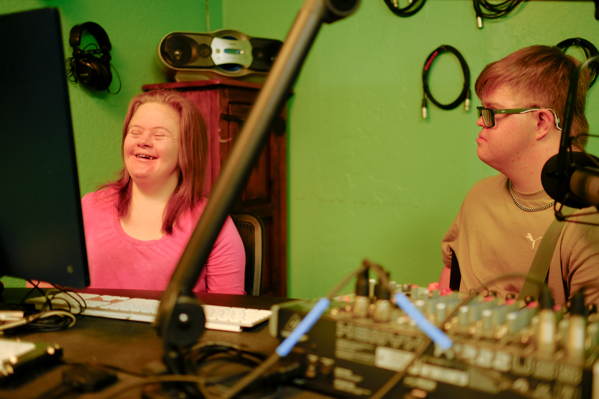 QC members reviewing controls at radio station